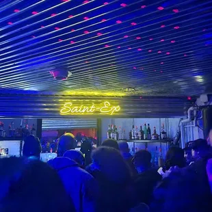 a crowd of people at a bar