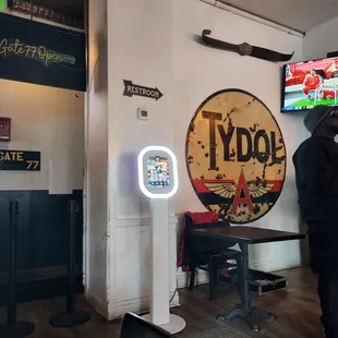 a man standing in front of a tv