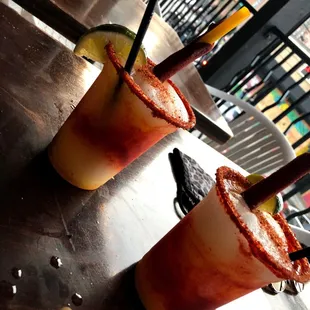 two bloody cocktails on a table