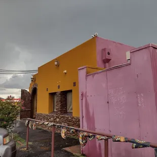 The entrance is dirty and there are gang tags on the restaurant itself.