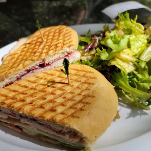 a sandwich and a salad on a plate