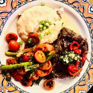 Braised short rib , cooked 16 hours in a beautiful red wine based sauce .