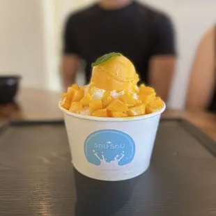 a cup of mango ice cream