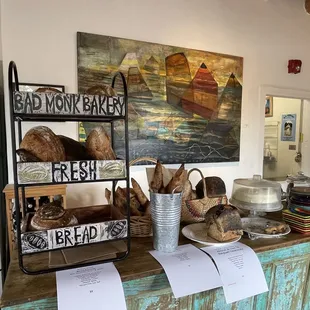 a bakery counter with bread and pastries
