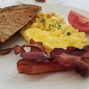 Sinclair breakfast - scrambled eggs, bacon, rye toast.