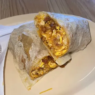a breakfast burrito on a plate