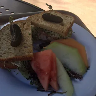 Turkey avocado on multigrain with fruit