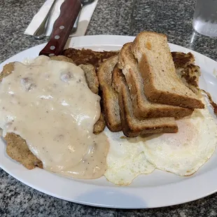 Chicken Fried Steak, over easy eggs, hash browns and whole wheat toast