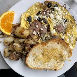 Sundried-tomato, olives and feta frittata with chicken sausage; comes with potatoes and homemade toast!