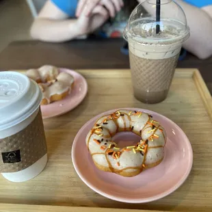 Pumpkin spice mochi donut, apple cider mochi donut, iced mocha and peppermint mocha.