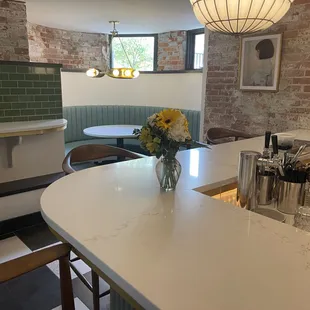 a table with a vase of flowers on it