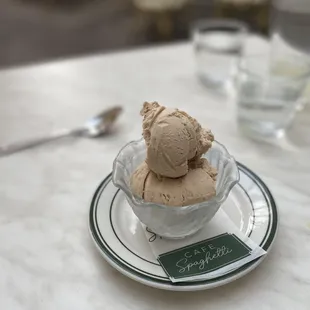 a bowl of ice cream on a plate