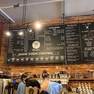 a menu on a brick wall