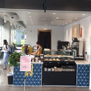 a woman working behind the counter