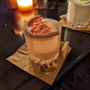 two cocktails on a glass table