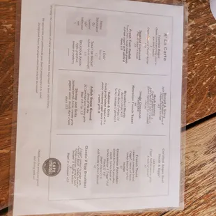 a menu on a wooden table