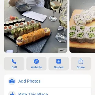 a photo of a plate of sushi and a glass of wine