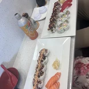 from left to right- Salmon Nigiri (raw), trio Amigo Roll, California roll, Dragon roll, Tuna Nigiri