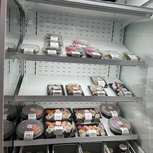 Some of the prepared sushi to go - they were filling up the fridge with more prepared sushi before they made our rolls