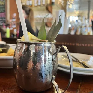 a cocktail in a copper mug