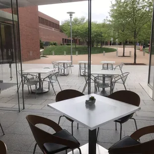 A glass partition separates the outside dining area from the inside dining area.  So beautiful!
