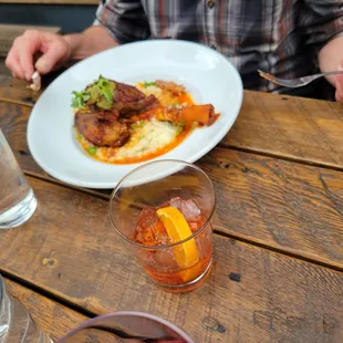 a plate of food and a glass of water