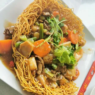 Crunchy Egg noodle dish. With a combination of beef, shrimp and vegetables.
