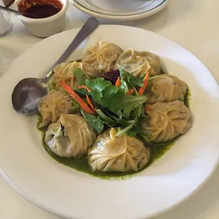 Ngotsei Momo (Spinach momo with feta and mozzarella)