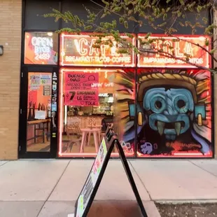 a sign in front of a restaurant