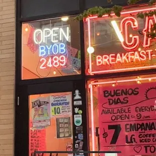 a neon sign in the window