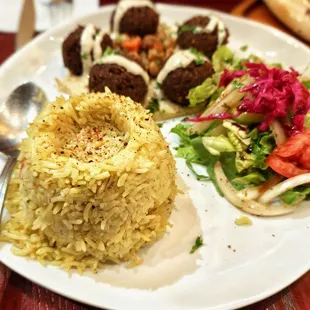 Falafel my way Plate - Crispy falafel bonbons served with homemade pickles, fava beans, hummus and garlic tahini sauce