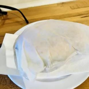 a plate of food on a wooden table