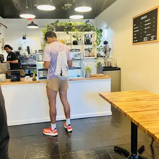 a man standing in front of a counter