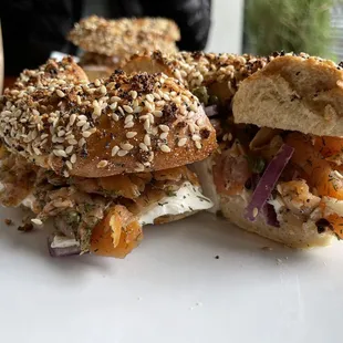 a bagel sandwich on a white plate