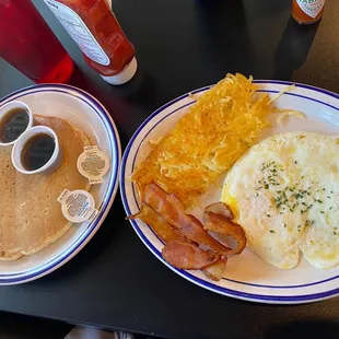 Two Eggs Breakfast with bacon, hash browns, and pancake.  YUMMMM!