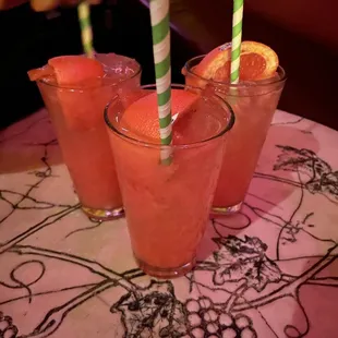 three glasses of orange juice