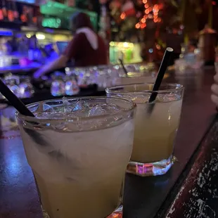 two cocktails on a bar