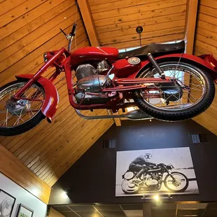 a motorcycle suspended from the ceiling