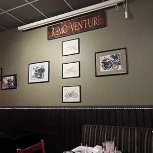 a restaurant with pictures on the wall