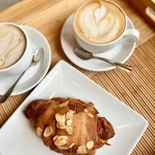 a croissant and a cup of coffee