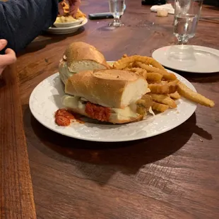 Chicken Parm sandwich with french fries