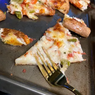 a piece of pizza and a fork