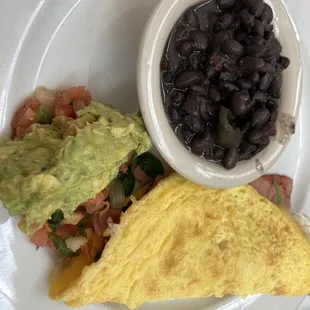 Breakfast omelette special-comes with two sides. I chose black beans &amp; a corn cake.