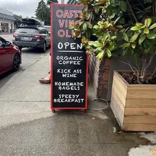 a sign on the sidewalk