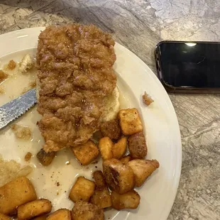 Chicken biscuit with breakfast potatoes