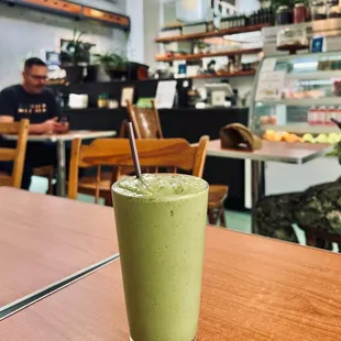 a green smoothie on a table