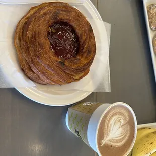 a croissant and a cup of coffee