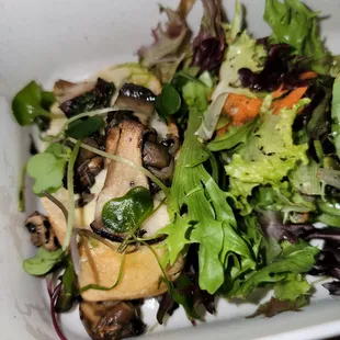 a salad in a white bowl