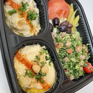 Mixed salad plate,hummus, baba ghanoush, tabbouleh salad. Perfect for a small party gathering of 4 people