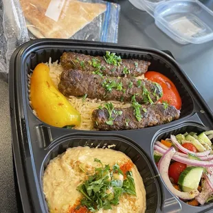 Kofta plate, ground beef kebab on a bed of rice with a side of humus, salad and pita bread. Excellent!